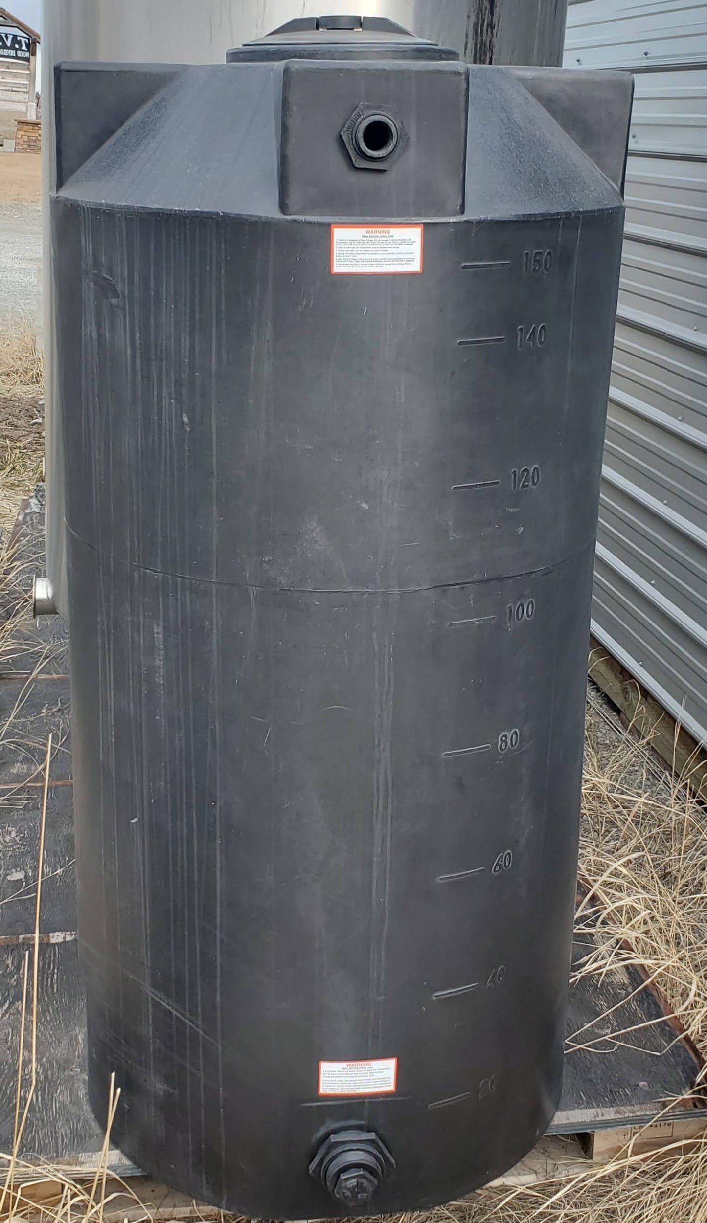 150 gallon Bushman black vertical polyethylene water storage tank with gallon markings
